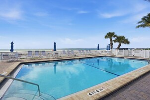 Outdoor pool, pool umbrellas, sun loungers