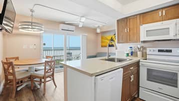 Deluxe Condo, Ocean View | Private kitchen | Full-size fridge, microwave, oven, stovetop