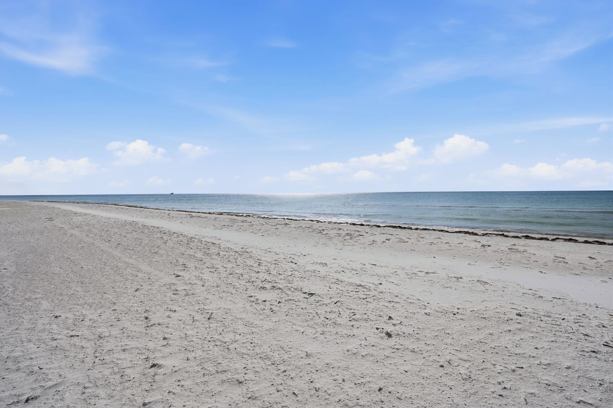 On the beach, sun loungers, beach volleyball