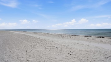 On the beach, sun loungers, beach volleyball