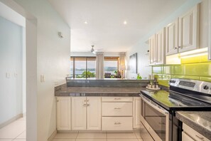 Fridge, microwave, oven, stovetop - Oceanfront Condo with Pool & Stunning Views (Playa Flamingo)