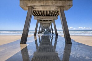 A concrete pier extending into the ocean with a clear sky above. - Tybee Beach Condo w/ Pool & Beach Access, Pets (Tybee Island)
