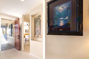 Hallway artwork and finishes add a welcoming touch as you return from your island adventures. - Fairway Villas Waikoloa | Golf Course View 2 BR | Free Car w/ 6+ Nts | FVW-L32 (Waikoloa Village)