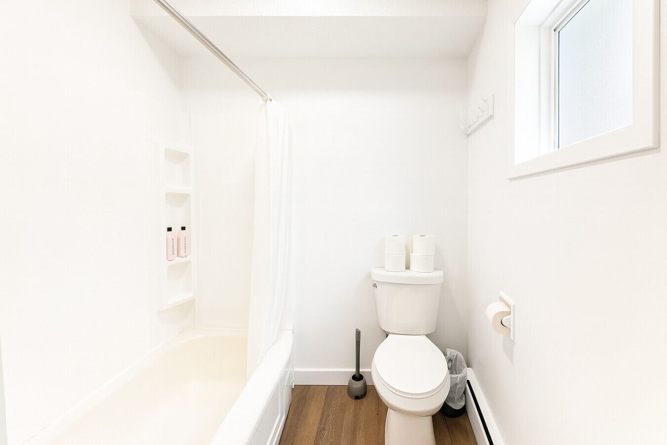 Hair dryer, towels, shampoo, toilet paper