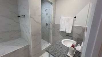 Shower, towels, soap, toilet paper