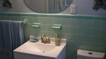 Shower, towels, soap, toilet paper