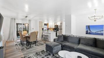 Gather around for games and conversations, soft Sofa-bed and 75" Smart TV