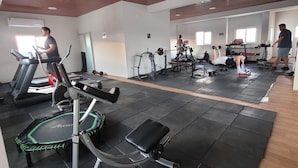 A gym with treadmills, a stationary bike, and various weight machines. - Mirador del Cielo  (Santa Cruz)
