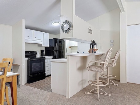 Fridge, microwave, oven, stovetop. Forest Hideaway • Screened Porch • Grill