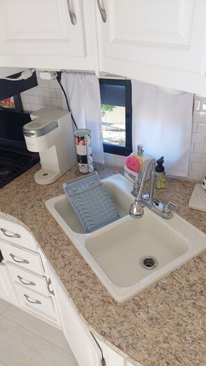 Fridge, microwave, stovetop, coffee/tea maker