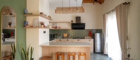 Fridge, microwave, stovetop, coffee/tea maker