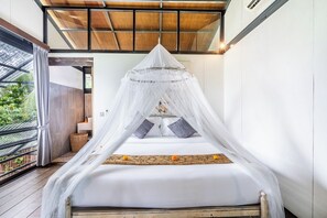 A room with a bed under a white canopy, a wooden floor, and a view of greenery outside. - Your Dream Waterfront Villa  (Kediri)