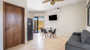 Family Apartment, Multiple Beds, Pool View (A10) | Living area | 32-inch Smart TV with digital channels