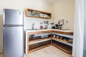 Family Apartment, Multiple Beds, Pool View (A10) | Private kitchen | Mini-fridge, microwave, stovetop, coffee/tea maker - Casa Wayra Tulum - Boutique Condos (Tulum)