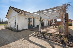 A single-story house with a covered patio area.