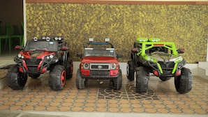 Three toy vehicles parked on a patterned floor. - Kpp Resort (Kalkulam)