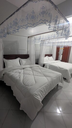 غرفة مريحة مزدوجة أو بسريرين منفصلين - منظر للحديقة | واي فاي مجانًا وملاءات أسرّة