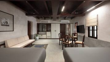 Deluxe Suite, Balcony, City View | Minibar, in-room safe, blackout curtains, iron/ironing board
