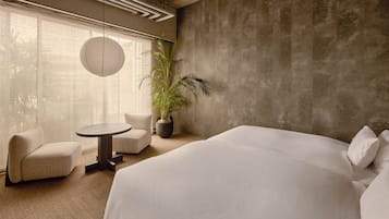 Habitación Deluxe con 2 camas individuales, para no fumadores, baño privado | Área de sala de estar
