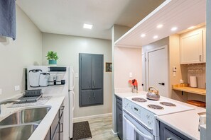 A modern kitchen with stainless steel appliances, a built-in oven, and a microwave. - < 1 Mi to Dtwn Texarkana: Couple's Retreat w/ Yard (Texarkana)