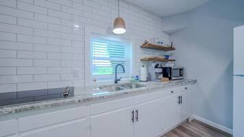 Fridge, microwave, stovetop, coffee/tea maker