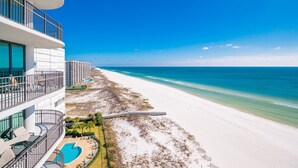A beachfront hotel with a pool, beach access, and ocean views. - Phoenix Ix 1107 2 Bedroom Condo (Orange Beach)