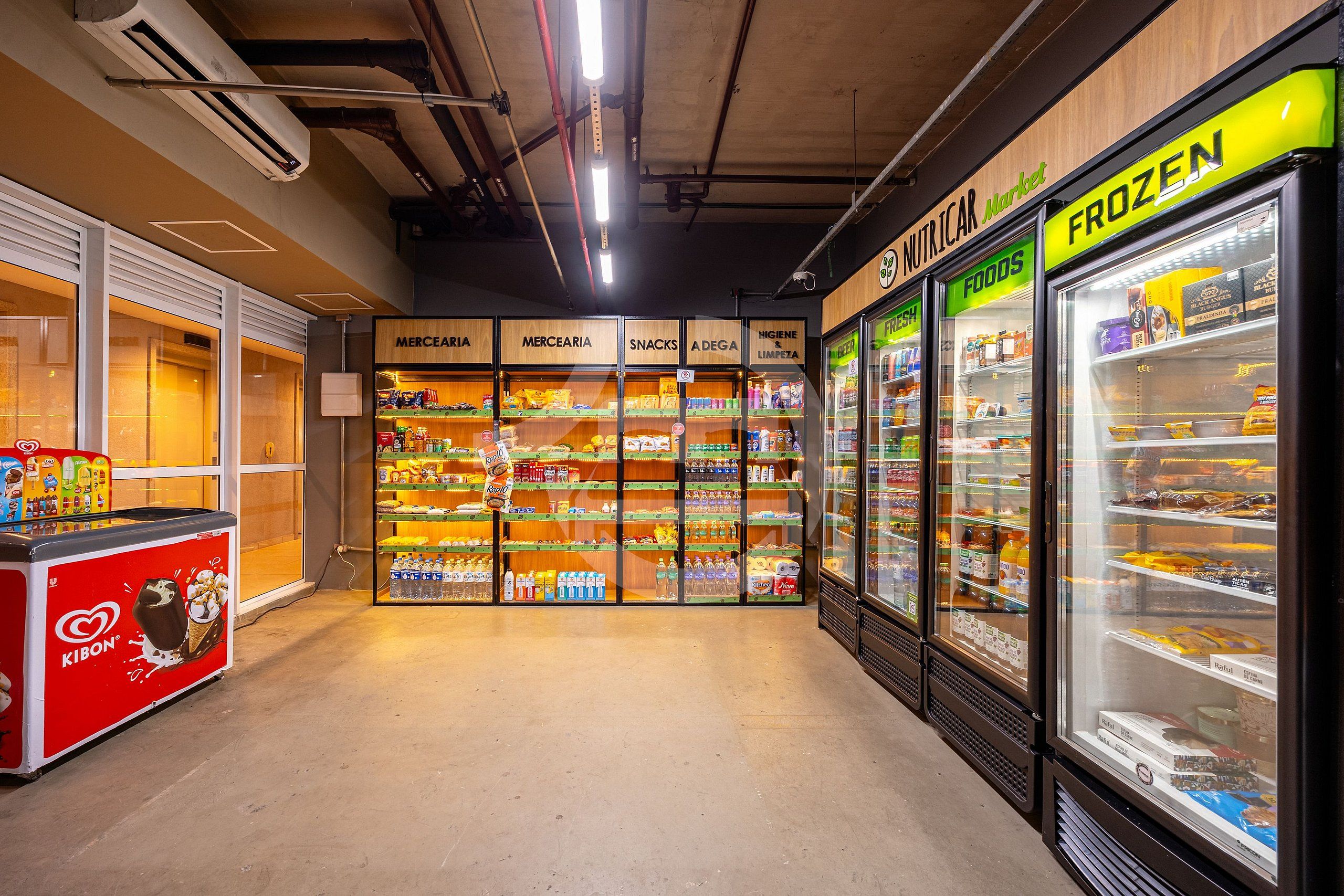 A grocery store interior with refrigerated sections labeled 'FROZEN' and 'NUTRICAR.' Shelves are stocked with various food items.