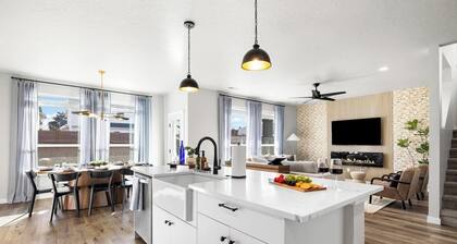 This 5-bedroom home has it all—gas fire pit for 8, hot tub, cornhole, ladder golf, ping pong, and a gas grill. Inside, enjoy a rock climbing wall, office desk, and a garage gym.