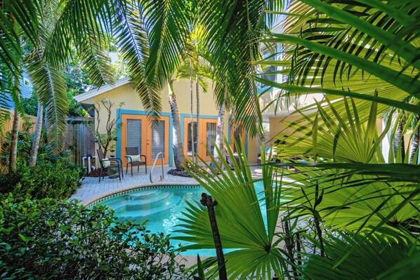 A heated pool - Newly Remodeled Island Cottage: Pool, Porch & Walk to Bean Point Beach (Anna Maria)
