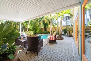 Terrace/patio - Newly Remodeled Island Cottage: Pool, Porch & Walk to Bean Point Beach (Anna Maria)