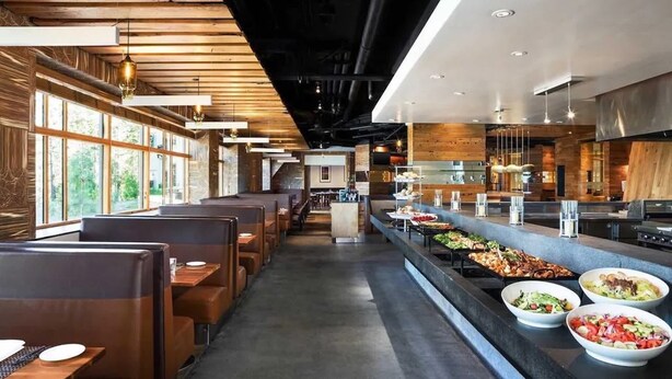 A restaurant with booths and a buffet area.