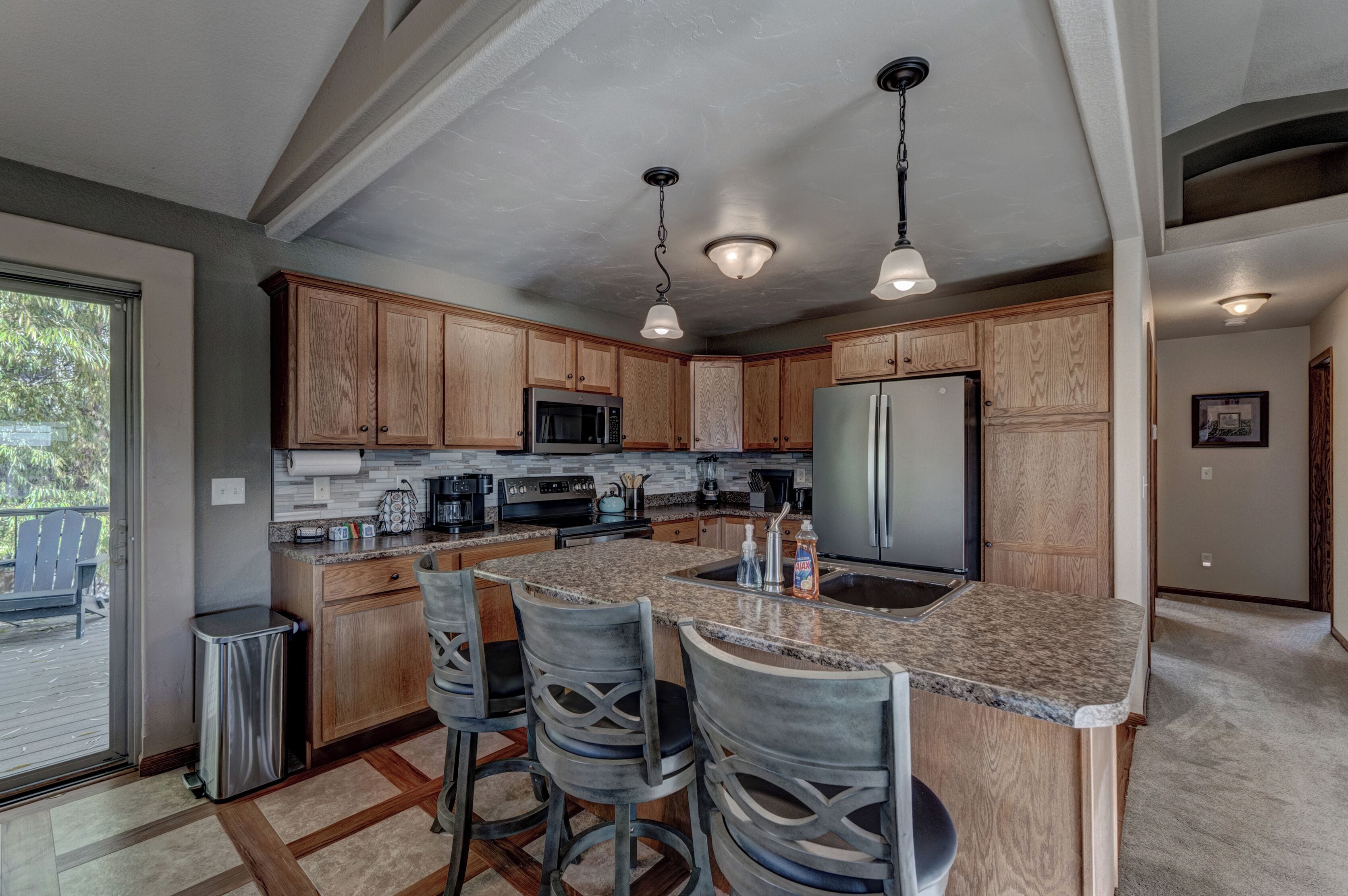 Full size kitchen with all necessary appliances, cookware, bakeware, and utensils