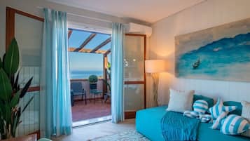 Deluxe appartement, uitzicht op zee | Woonruimte