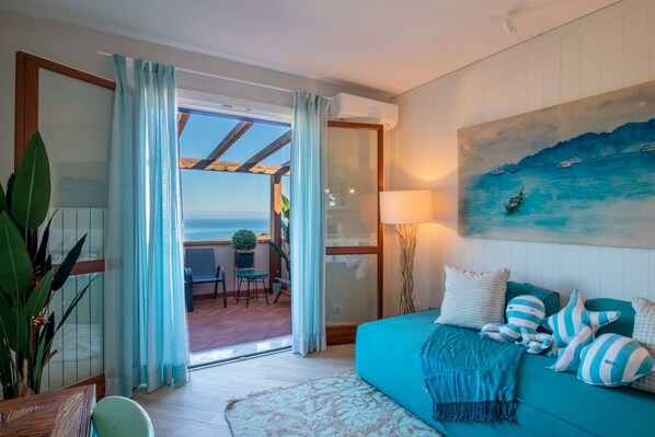 Apartamento Deluxe, vistas al mar | Zona de estar