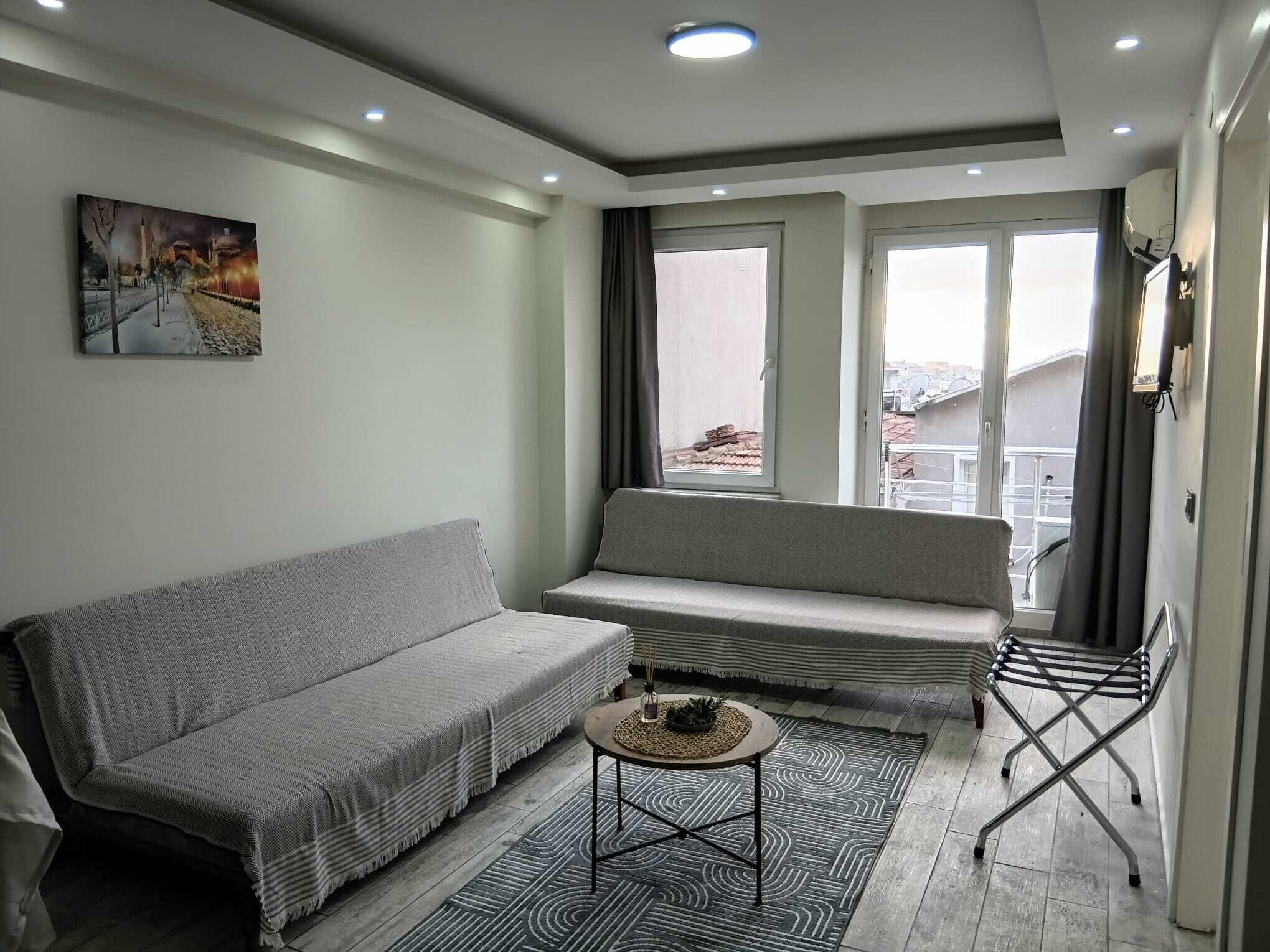Deluxe Family Suite | Living area | 120-inch Smart TV with satellite channels, video game console, Netflix