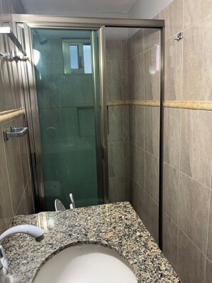 Shower, towels, soap, toilet paper