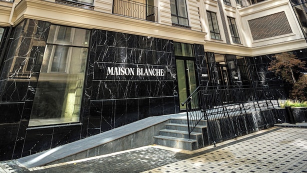 A high-rise building with a prominent entrance labeled "MAISON BLANCHE." - Premium Central Apartment • Eminescu Residence (Chișinău)