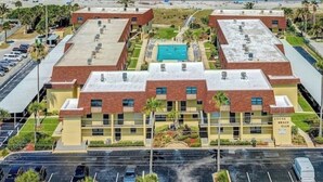 A hotel with a pool, located near a beach. - Upscale Unit with 2 King Beds-One Level-Pool Front- Steps to Sand Beach & Pier! (Cocoa Beach)