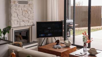 Deluxe Villa, Lake View | Living area | 55-inch Smart TV with digital channels