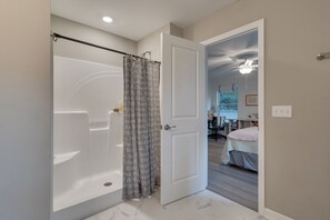 Shower, hair dryer, towels, toilet paper