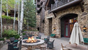 A stone building with a fire pit and outdoor seating. -  Bachelors Gulch Condo- 2 Bed and 2 1/2 bath. (Avon)