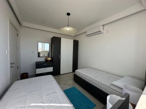Bright second bedroom with two comfortable single beds. - Panoramic Penthouse Stay • Front & Back Terraces (Ta` Sannat)
