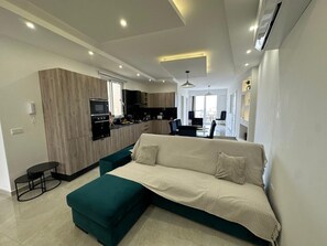 Bright open-plan living area filled with natural light - Panoramic Penthouse Stay • Front & Back Terraces (Ta` Sannat)