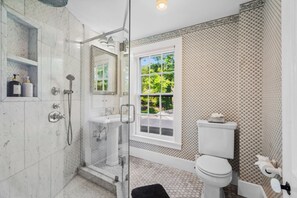 Shower, hair dryer, towels, soap