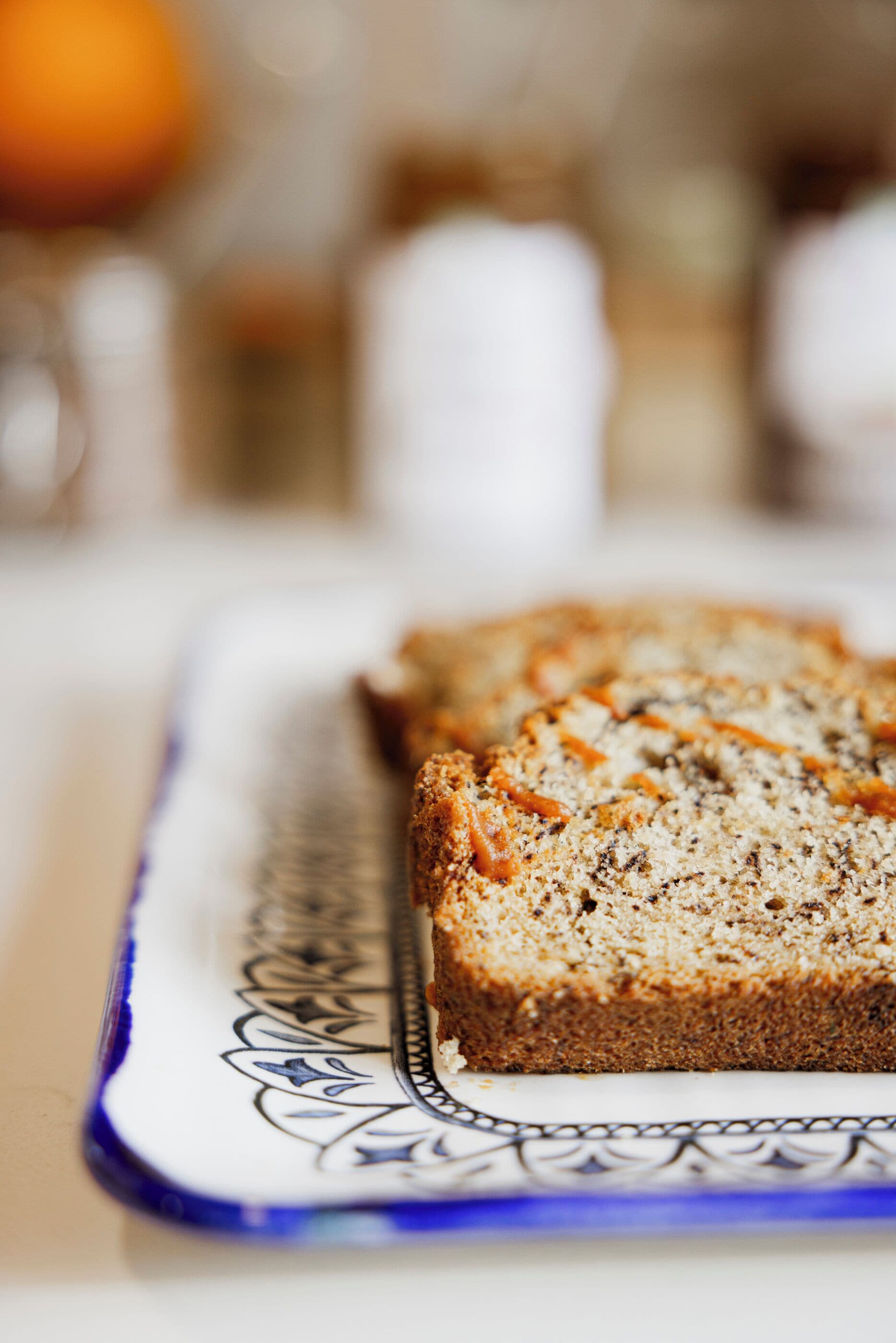 A slice of bread on a decorative plate.