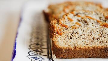 A slice of bread on a decorative plate.