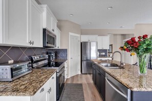 Private kitchen - Relax in Cranston: Spacious 3-Bedroom Calgary Home (Calgary)