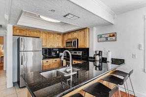 Coffee/tea maker, fridge, microwave, oven - Egret Escape at Del Mar - Charming Condo w/ Heated Pool, Beach Equipment, & Steps To The Beach (Indian Rocks Beach)