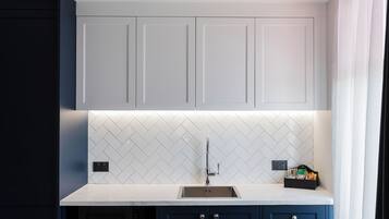 Mini-fridge, microwave, cookware/dishes/utensils