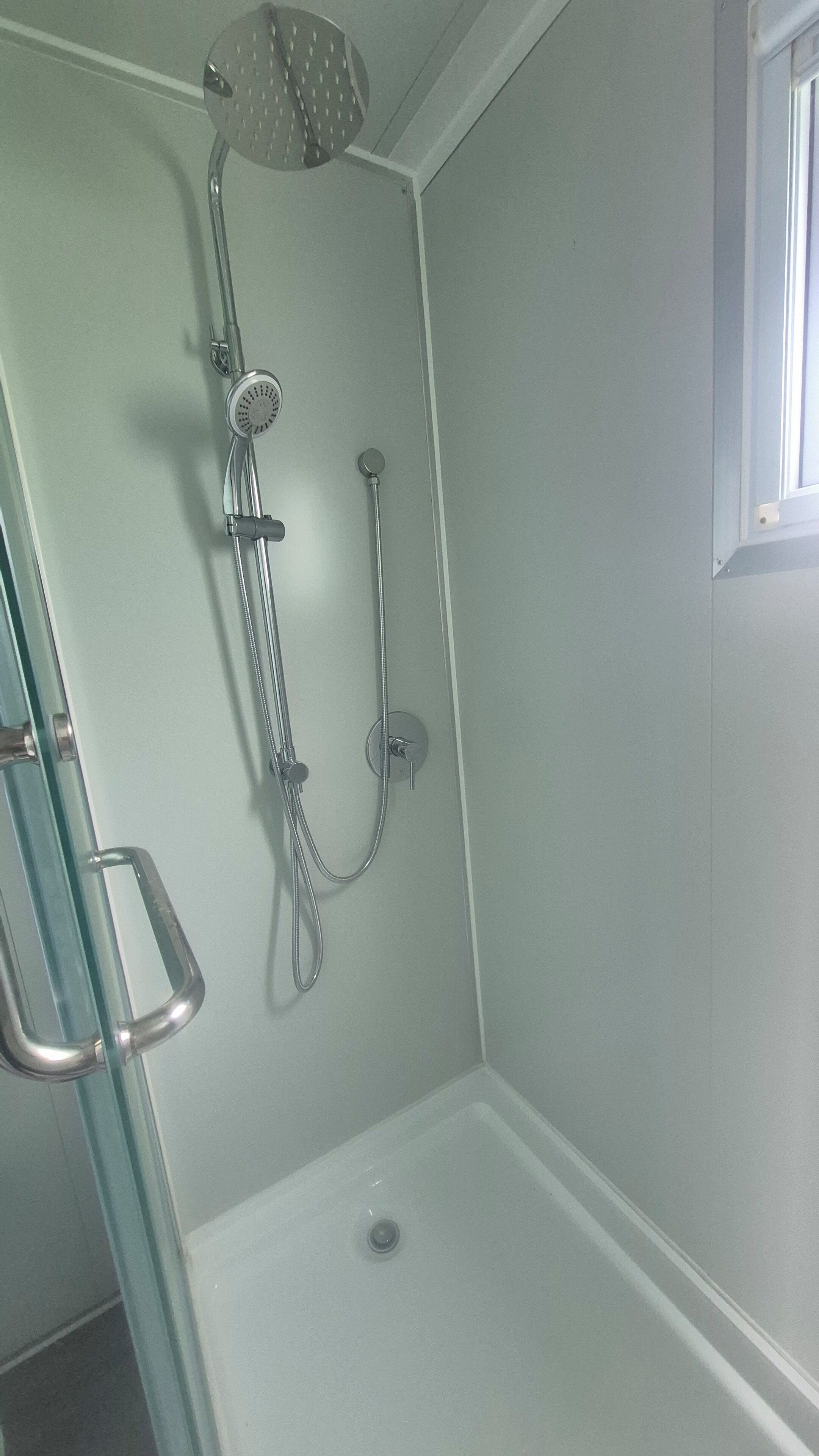 Shower, towels, soap, toilet paper